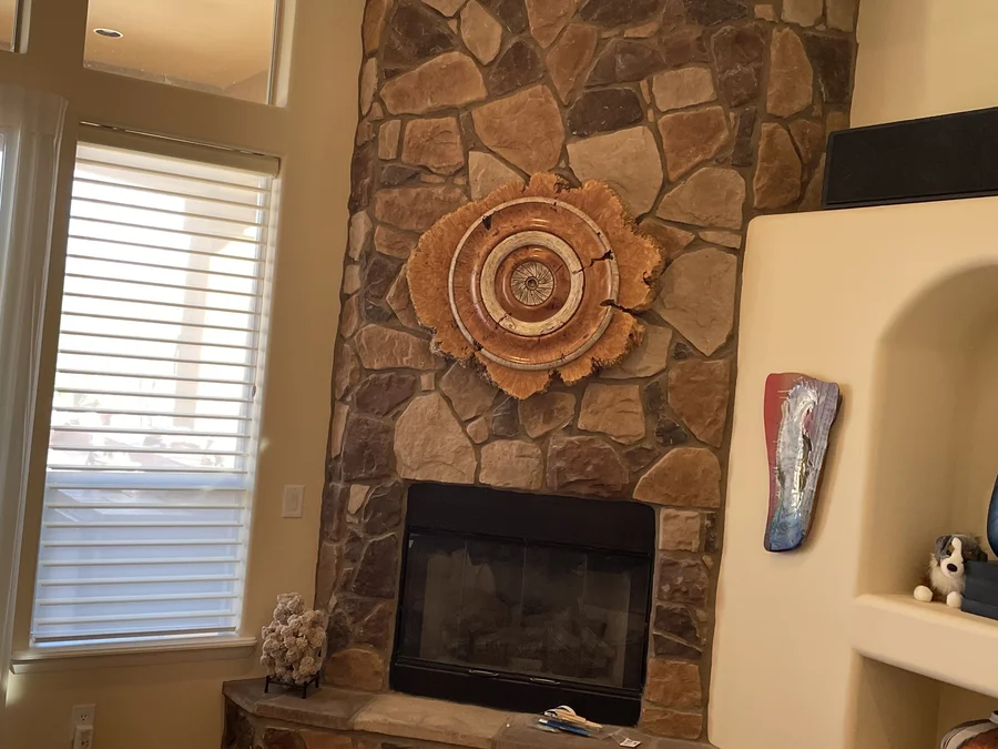 Wood sculpture installed in a fireplace